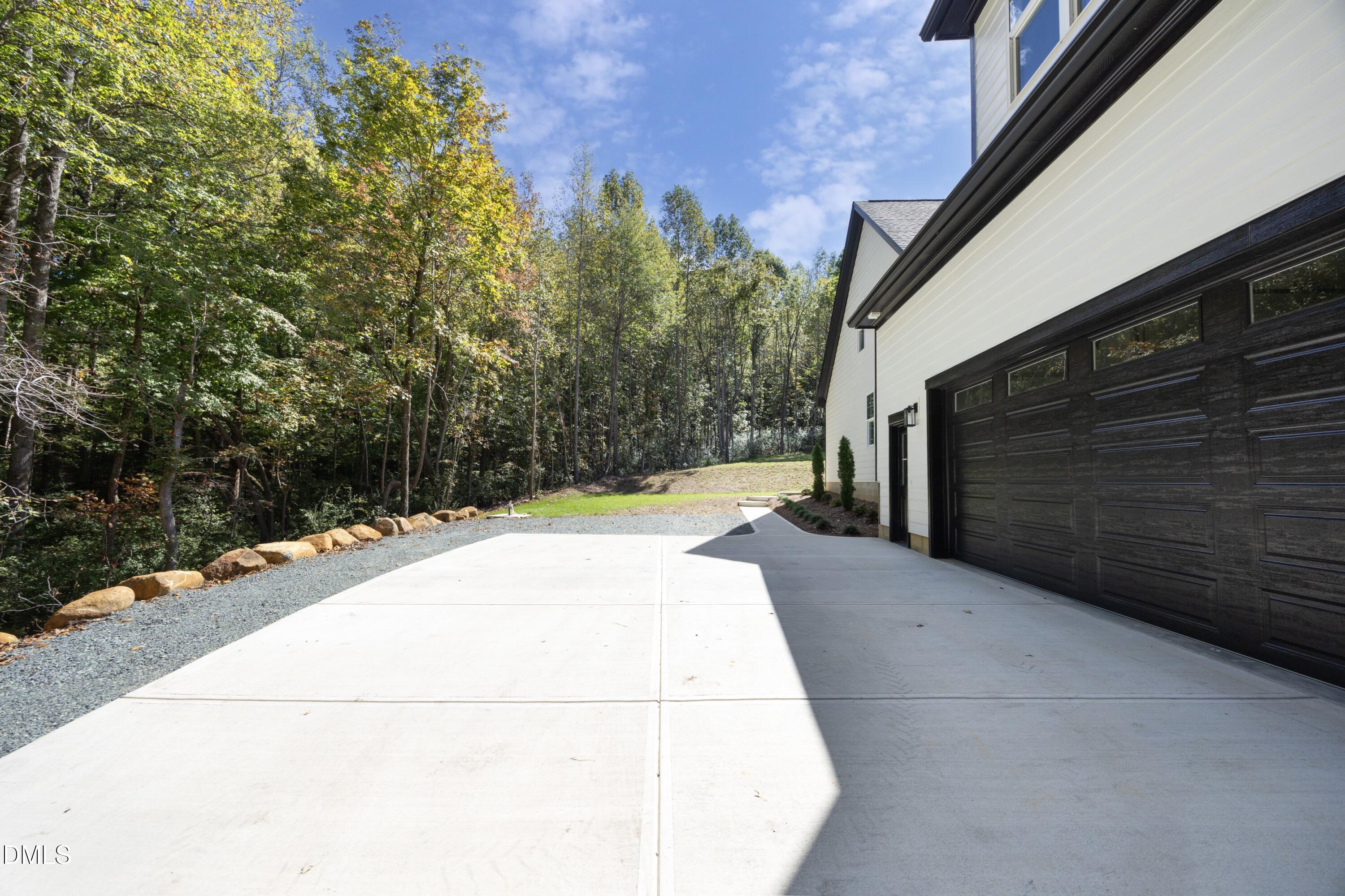 2817 Silk Hope Gum Springs Road Pittsboro, NC 27312 - Photo 46 of 56 a view of a backyard of the house
