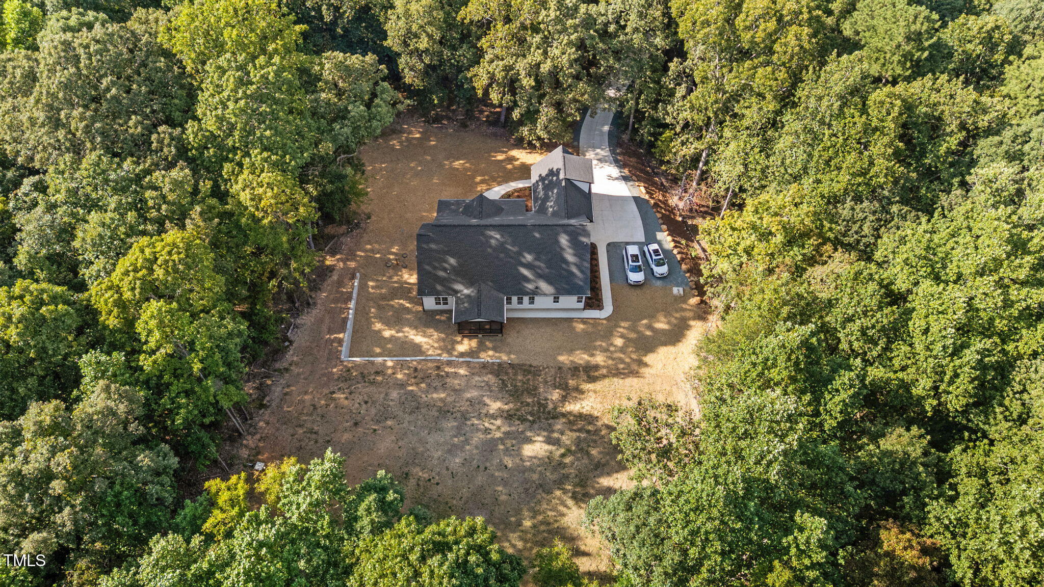 2817 Silk Hope Gum Springs Road Pittsboro, NC 27312 - Photo 51 of 56 a view of a tree with a yard