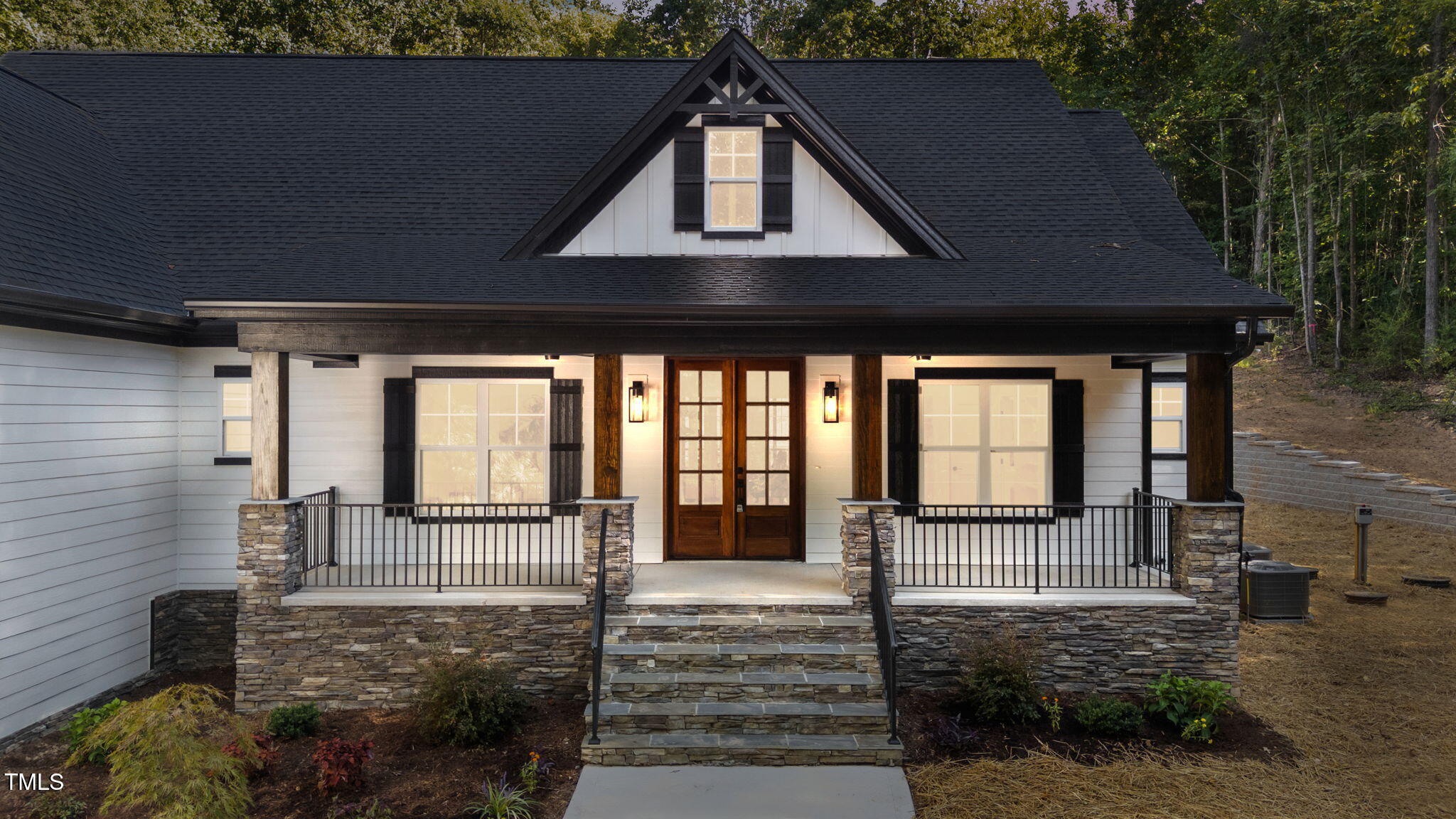 2817 Silk Hope Gum Springs Road Pittsboro, NC 27312 - Photo 54 of 56 a front view of a house with a yard