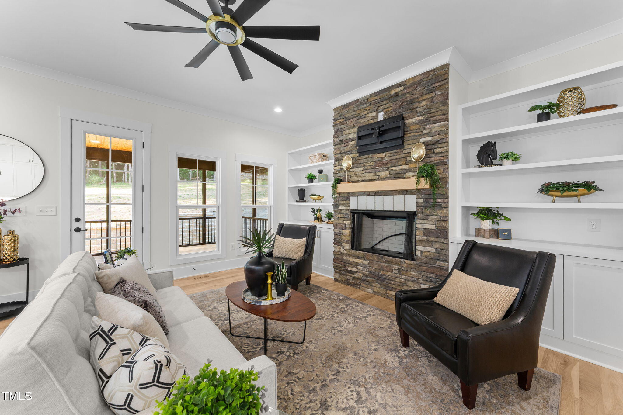 2817 Silk Hope Gum Springs Road Pittsboro, NC 27312 - Photo 9 of 56 a living room with furniture and a fireplace