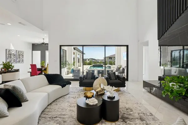 a living room with furniture and a large window
