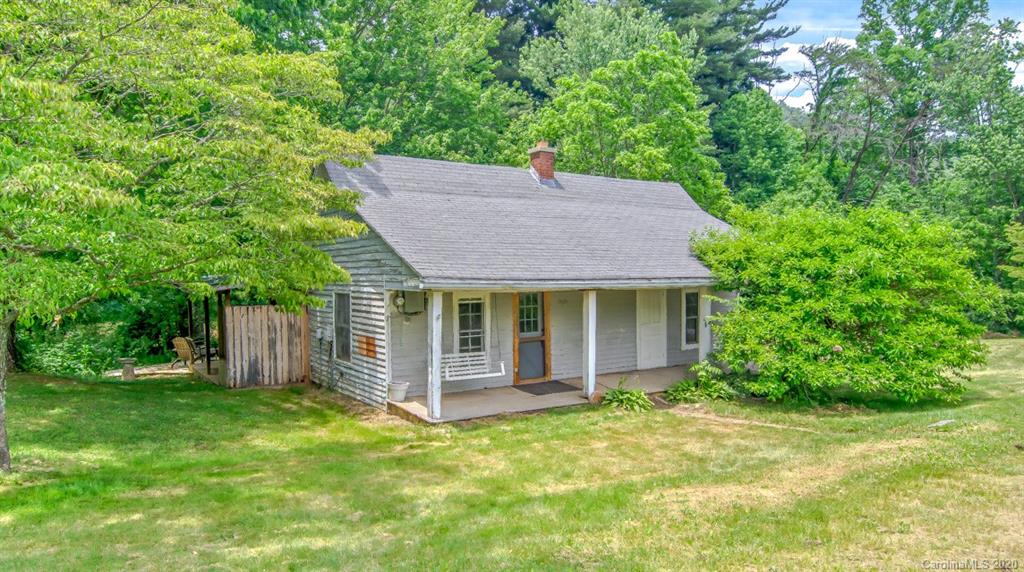 5020 Dutch Cove Road Canton, NC 28716 - Photo 1 of 19 front view of a house with a yard and large trees