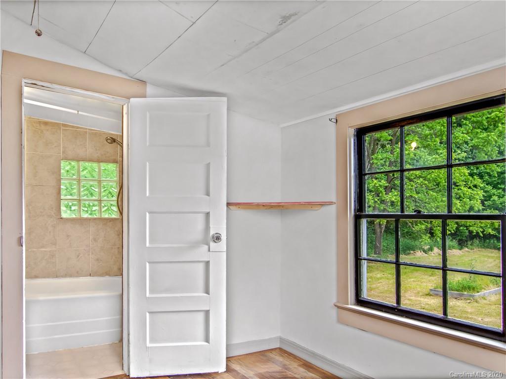5020 Dutch Cove Road Canton, NC 28716 - Photo 11 of 19 an empty room with windows and closet