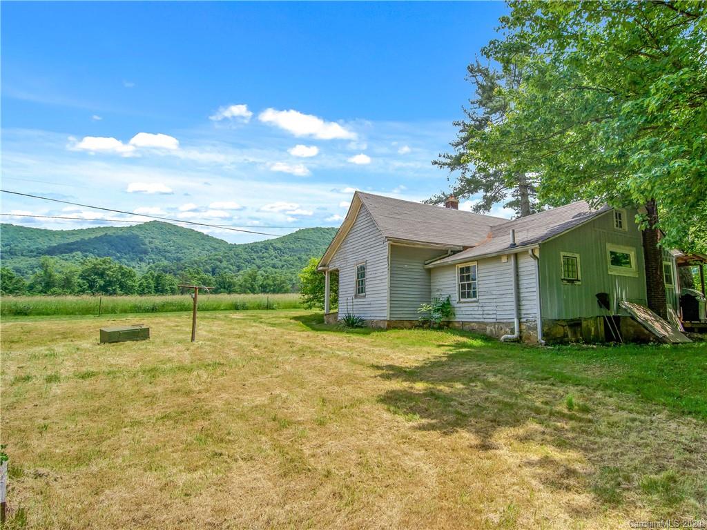 5020 Dutch Cove Road Canton, NC 28716 - Photo 17 of 19 a view of a house with a yard and a large tree
