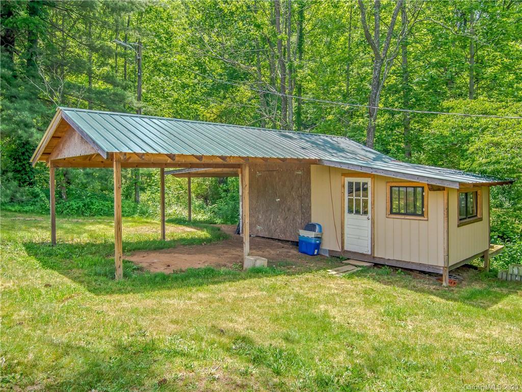 5020 Dutch Cove Road Canton, NC 28716 - Photo 19 of 19 a view of a house with backyard and porch