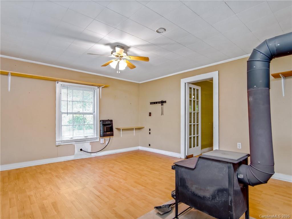 5020 Dutch Cove Road Canton, NC 28716 - Photo 4 of 19 a bedroom with furniture and a window