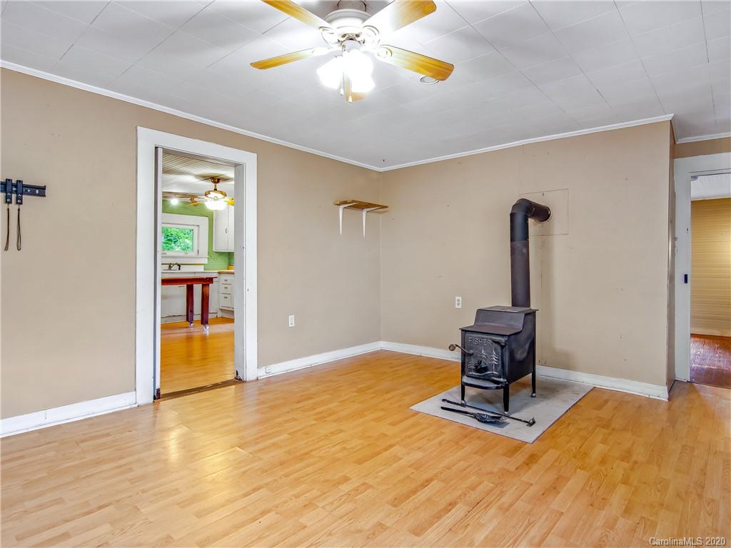 5020 Dutch Cove Road Canton, NC 28716 - Photo 5 of 19 a view of room with a window and wooden floor