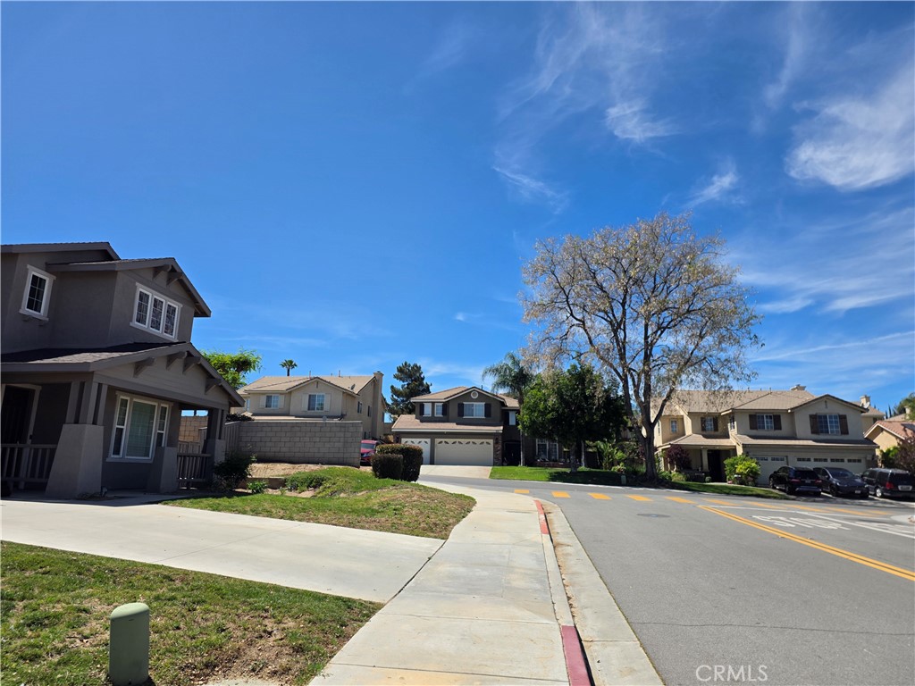 20329 Red Poppy Lane Riverside, CA 92508 - Photo 23 of 24 a front view of a house with a yard
