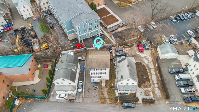 a view of a white building among the street