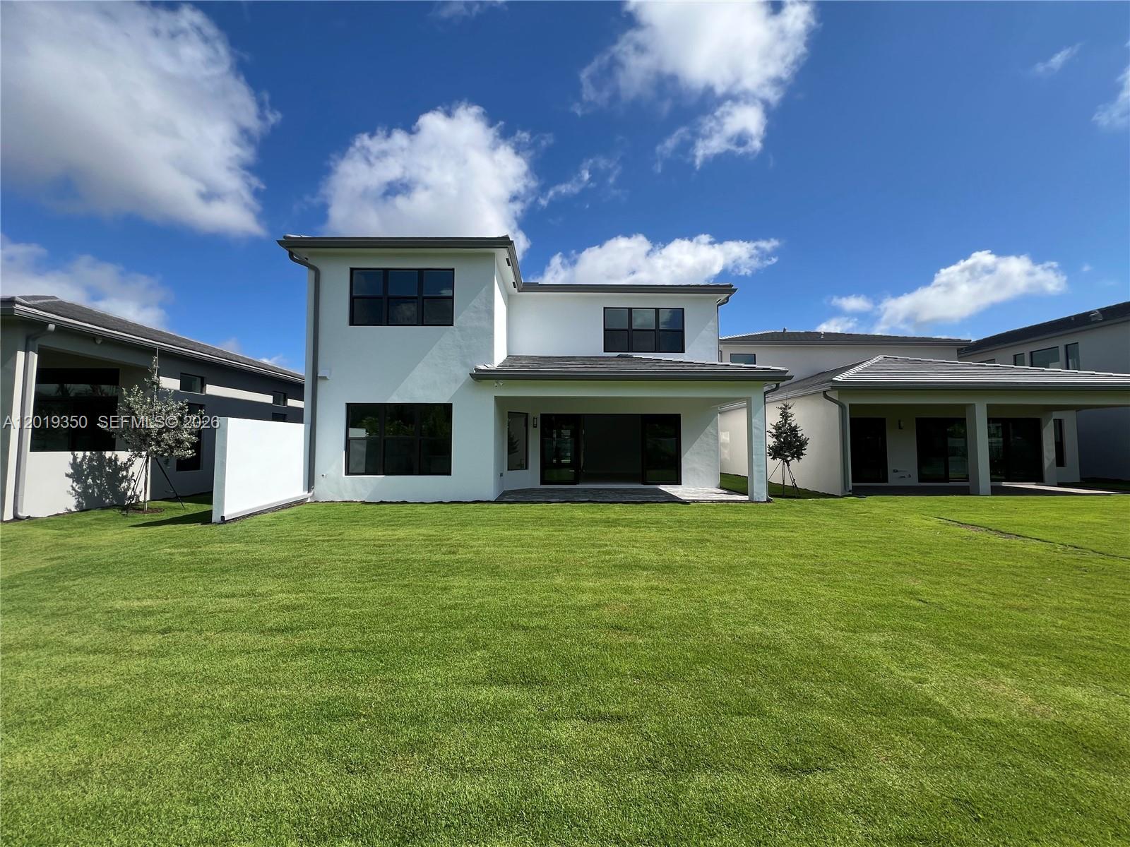 9172 Silver Marsh Lane, Unit 9172 Boca Raton, FL 33434 - Photo 21 of 34 a front view of a house with a garden