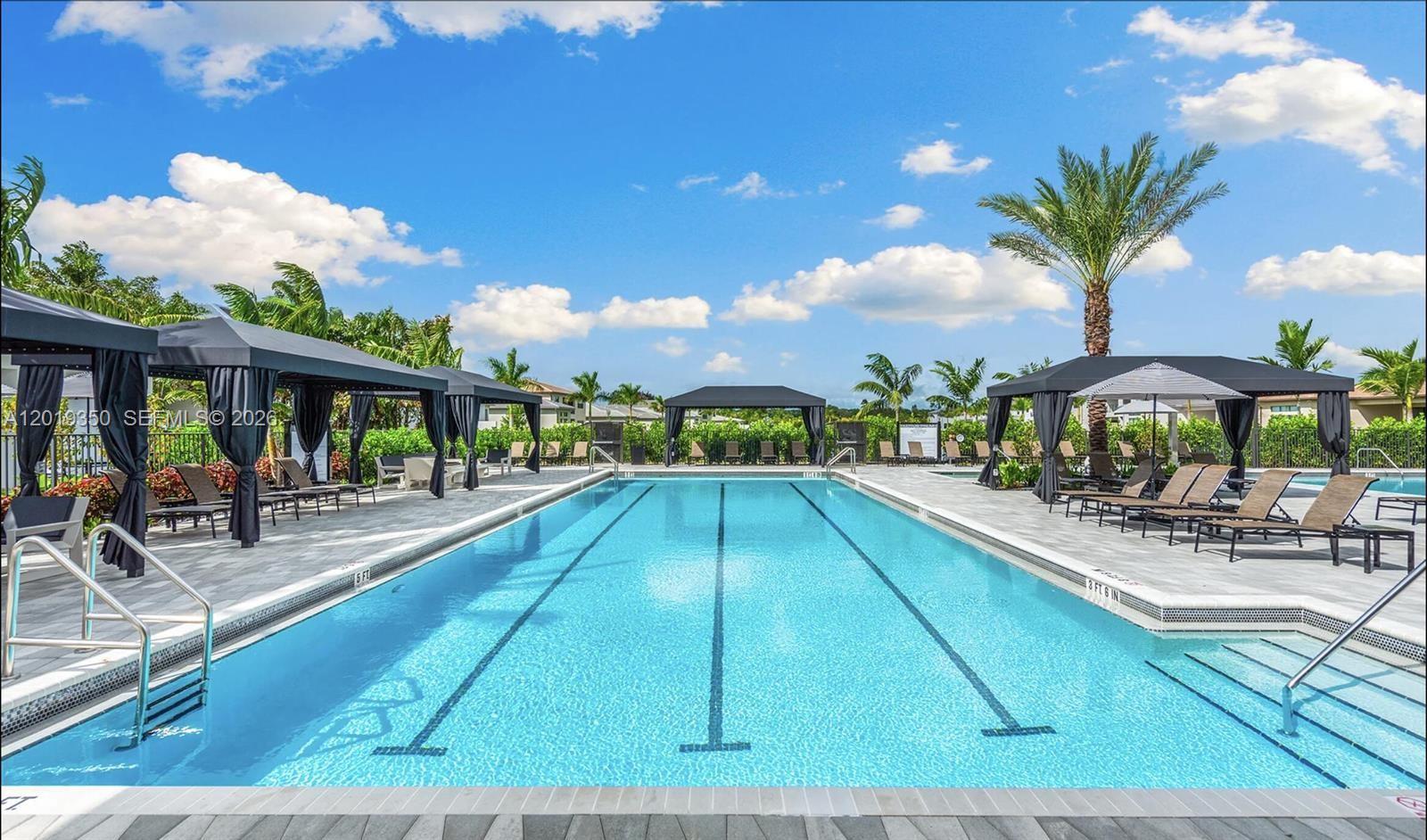 9172 Silver Marsh Lane, Unit 9172 Boca Raton, FL 33434 - Photo 26 of 34 a view of swimming pool with outdoor seating