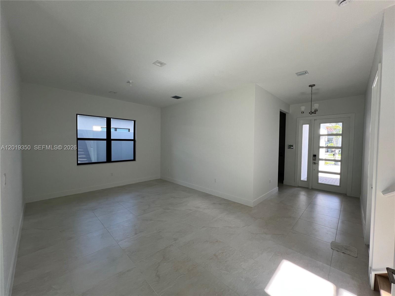 9172 Silver Marsh Lane, Unit 9172 Boca Raton, FL 33434 - Photo 3 of 34 an empty room that has a window