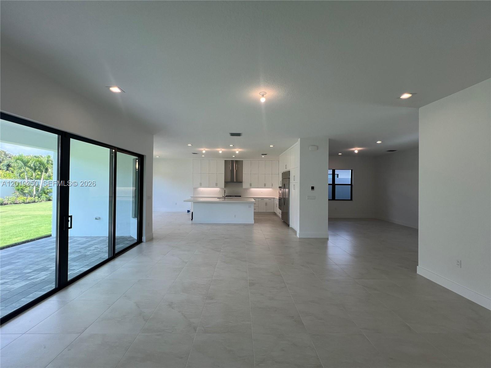 9172 Silver Marsh Lane, Unit 9172 Boca Raton, FL 33434 - Photo 4 of 34 a view of empty room with a kitchen