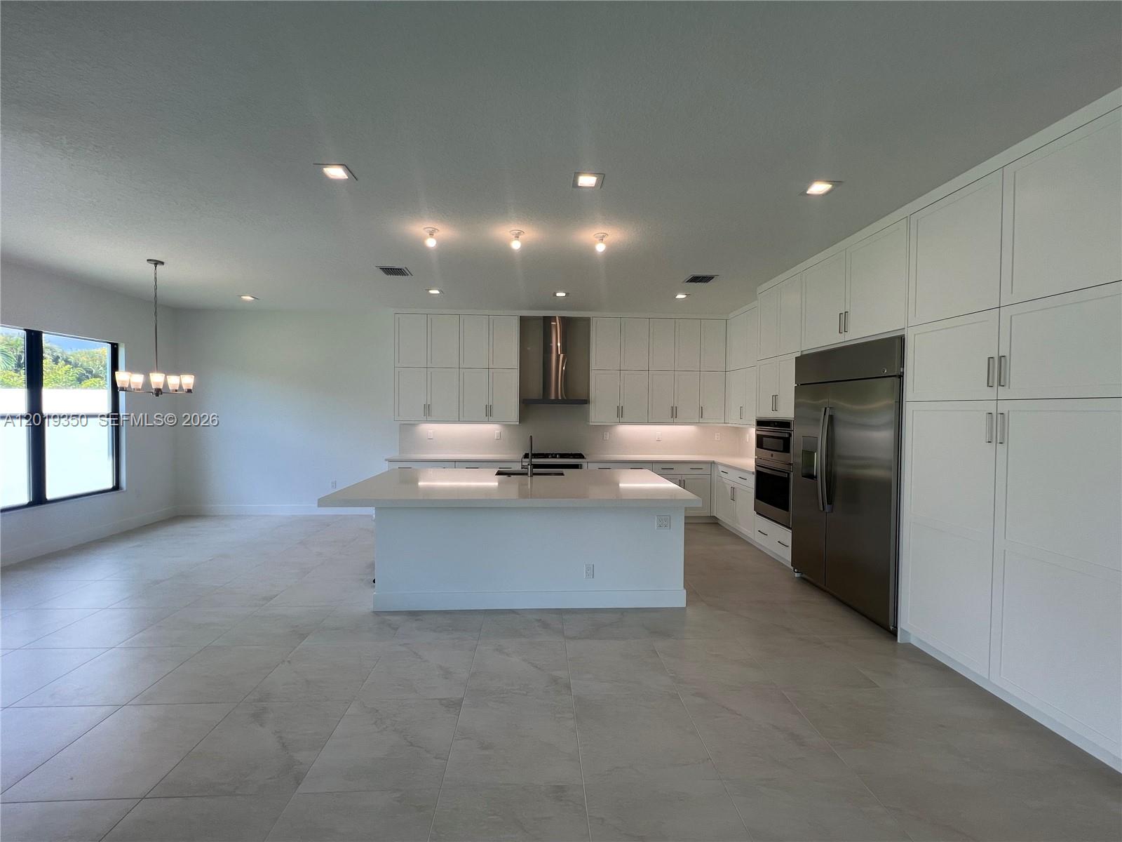 9172 Silver Marsh Lane, Unit 9172 Boca Raton, FL 33434 - Photo 8 of 34 a view of kitchen with refrigerator sink and cabinets