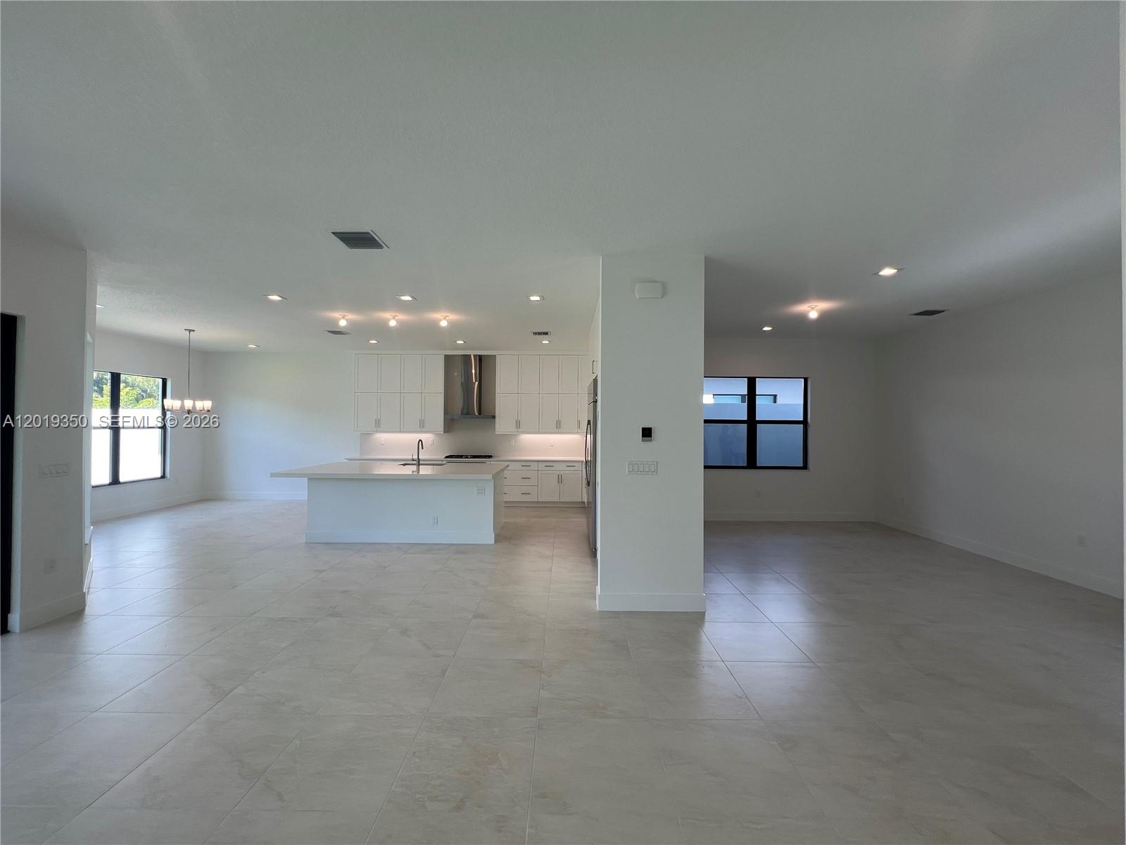 9172 Silver Marsh Lane, Unit 9172 Boca Raton, FL 33434 - Photo 9 of 34 a view of a big room with kitchen view and a window