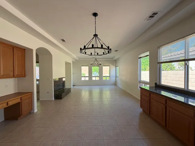 a view of a kitchen with a sink cabinet and a window
