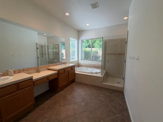 a large room with a large window and furniture