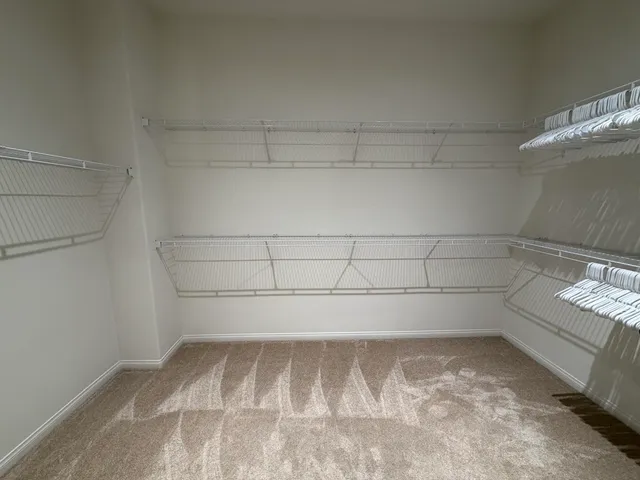 a view of a room with racks on the wall