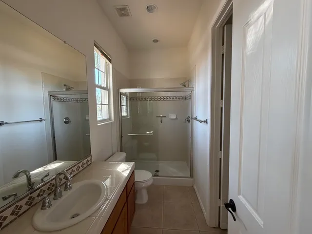 a utility room with sink dryer and washer