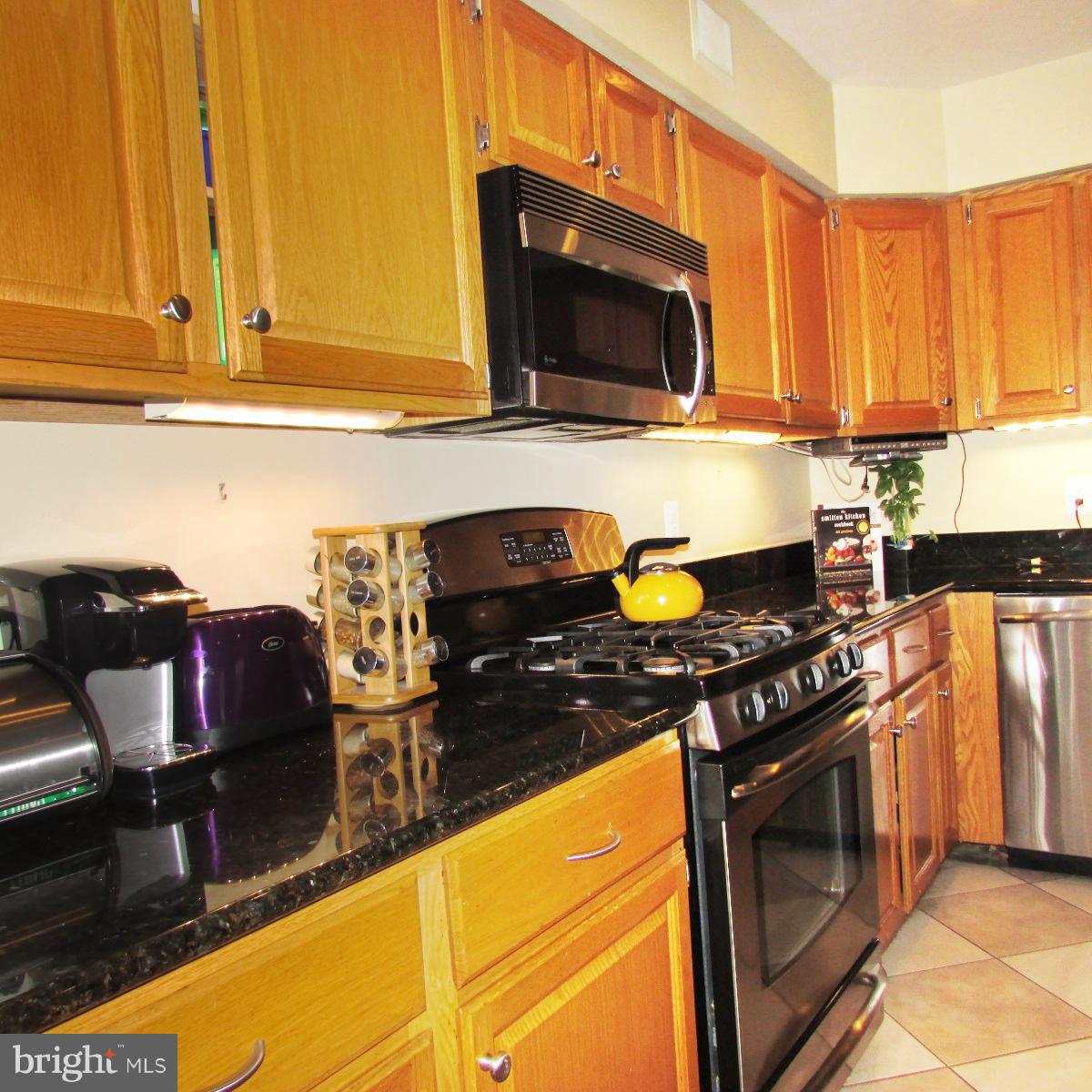 6733 Baron Road McLean, VA 22101 - Photo 8 of 29 The kitchen has stainless appliances and granite