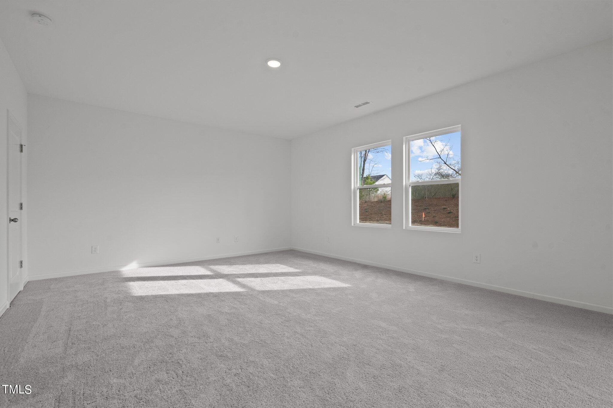 904 Rift Vly Drive Zebulon, NC 27597 - Photo 17 of 43 an empty room with windows