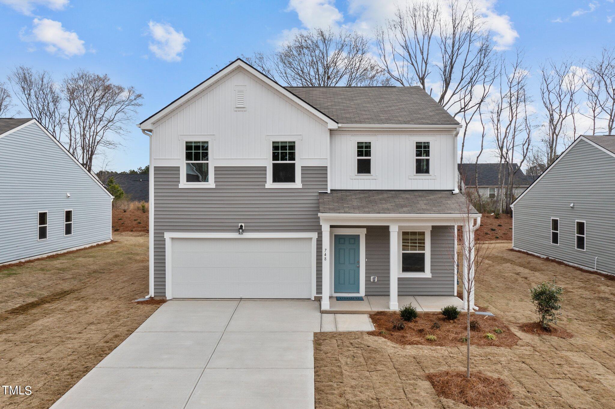 904 Rift Vly Drive Zebulon, NC 27597 - Photo 2 of 43 a front view of a house with a yard