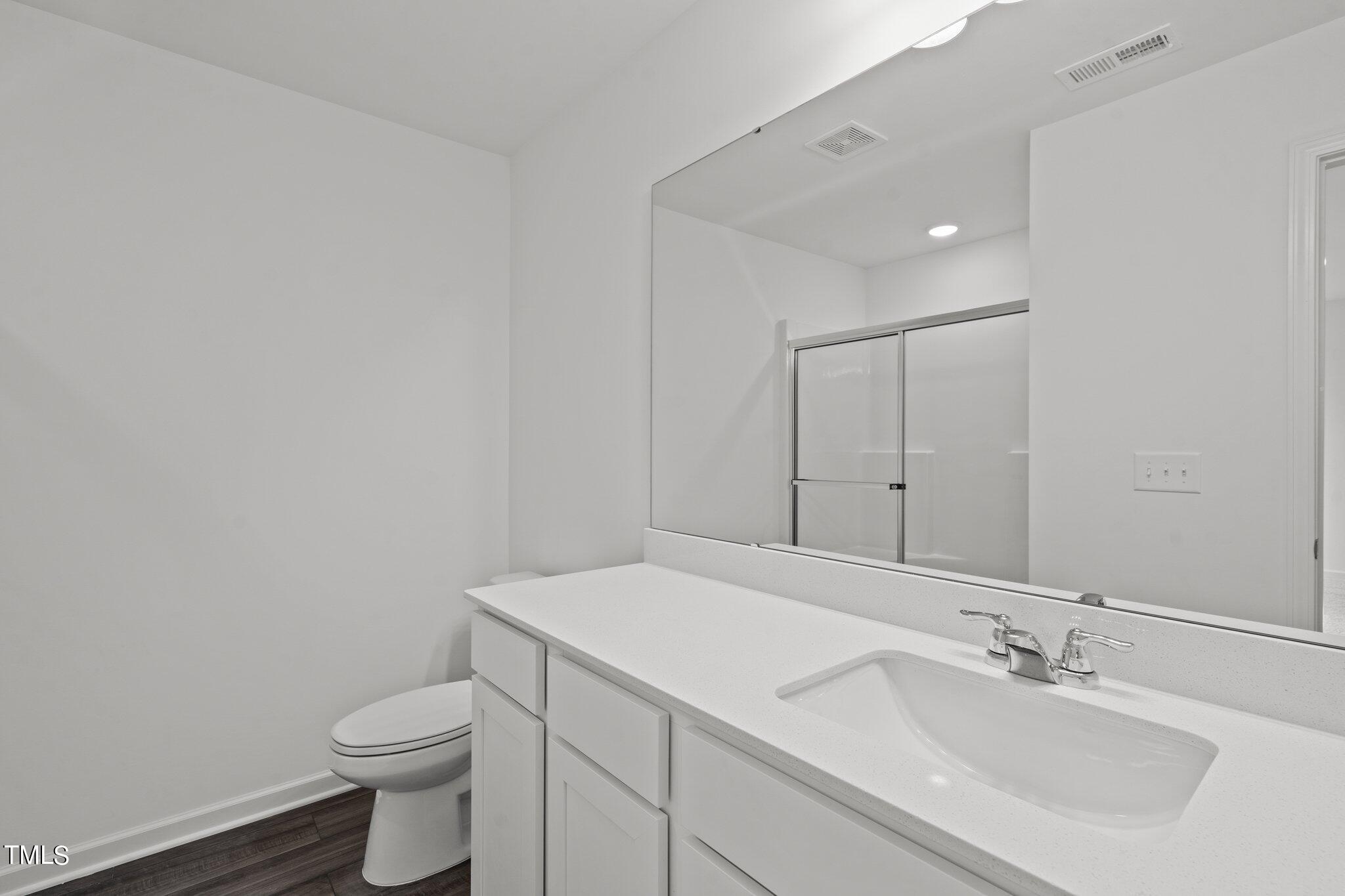 904 Rift Vly Drive Zebulon, NC 27597 - Photo 24 of 43 a bathroom with a sink toilet and vanity