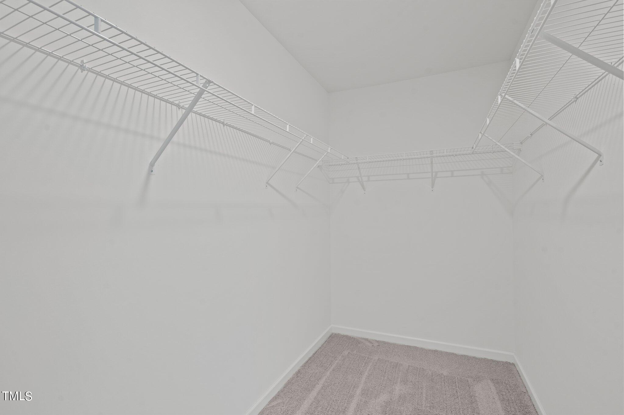 904 Rift Vly Drive Zebulon, NC 27597 - Photo 25 of 43 a view of a room with racks on the wall