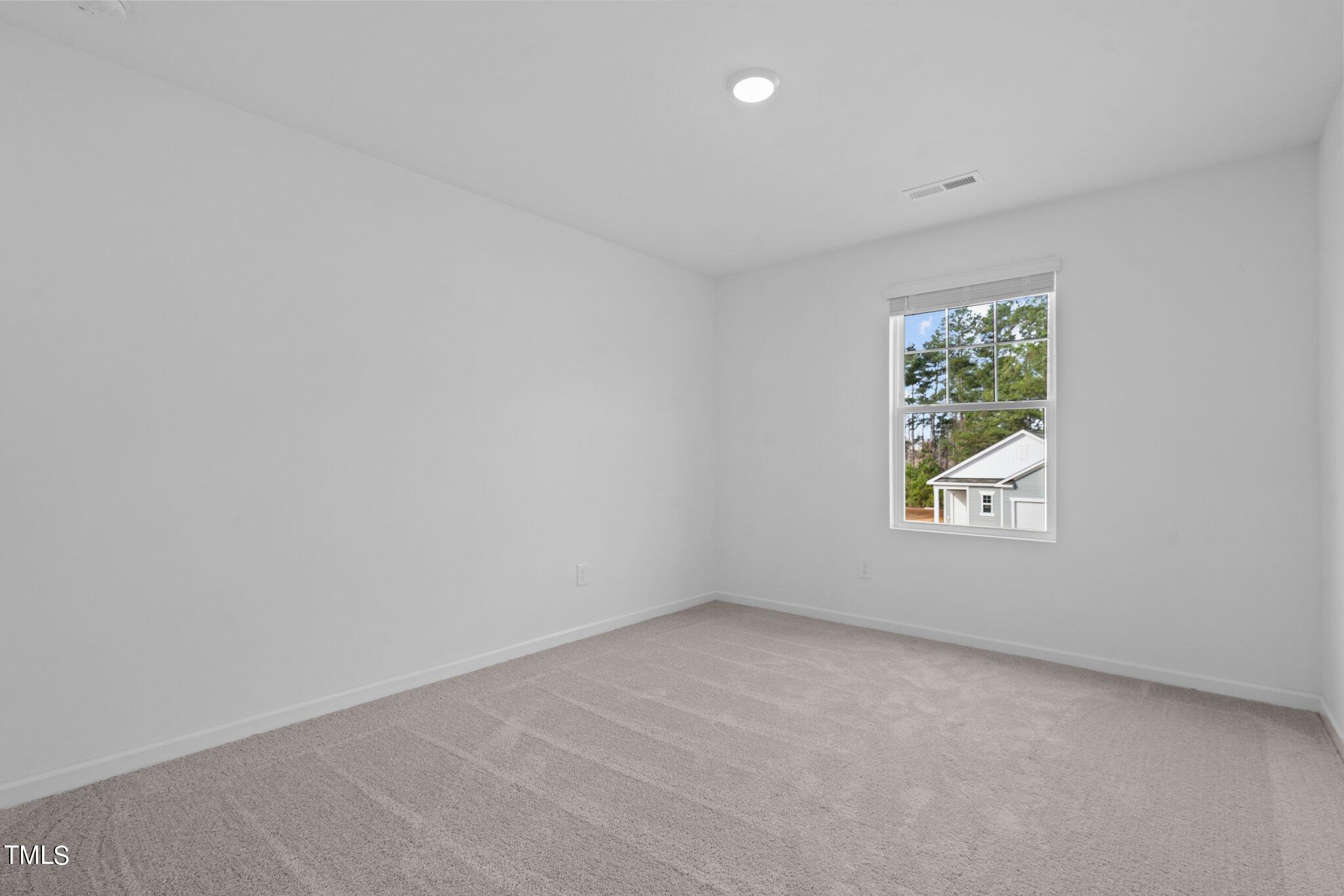 904 Rift Vly Drive Zebulon, NC 27597 - Photo 26 of 43 an empty room with windows