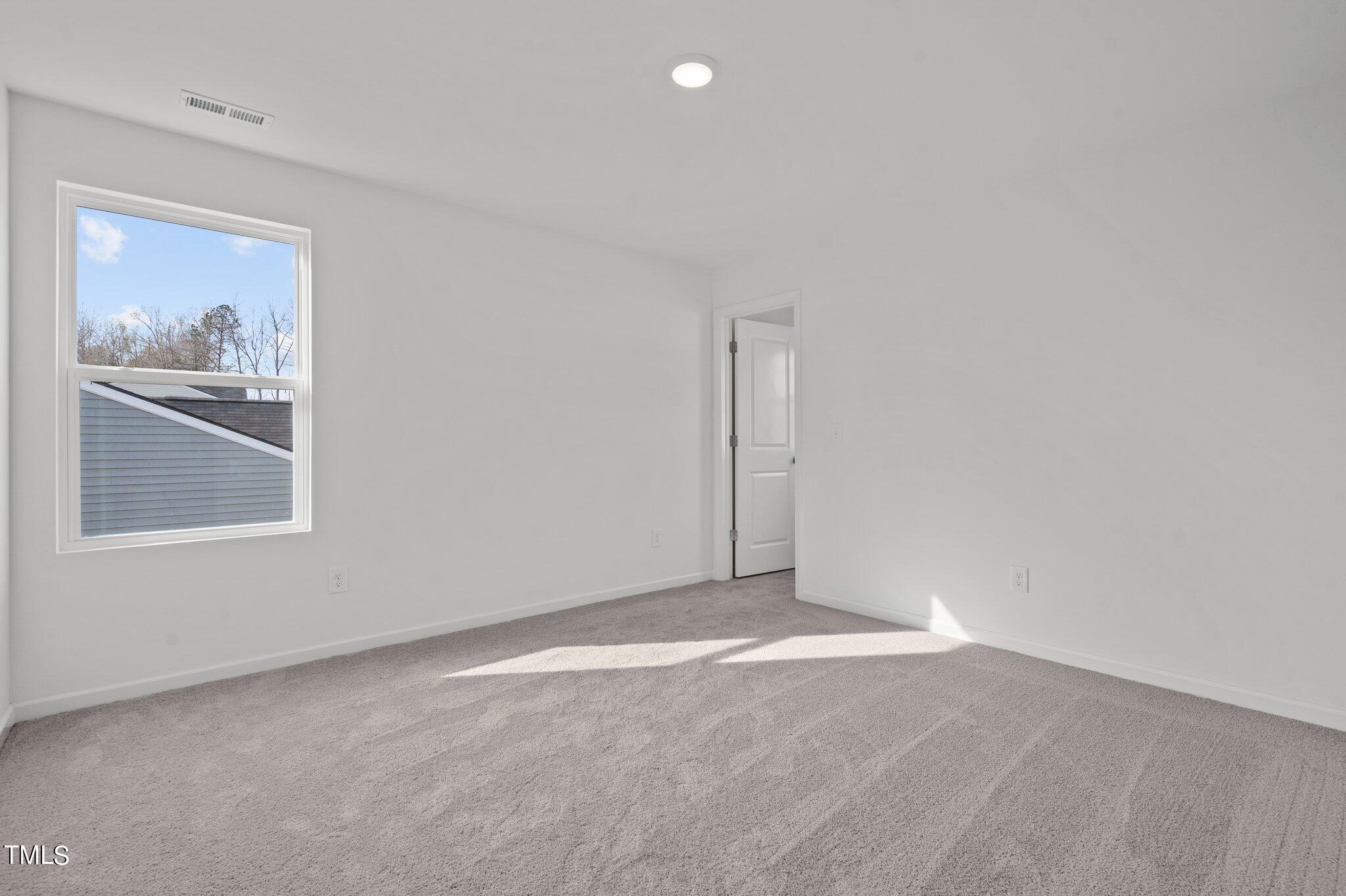 904 Rift Vly Drive Zebulon, NC 27597 - Photo 30 of 43 a view of an empty room with a window