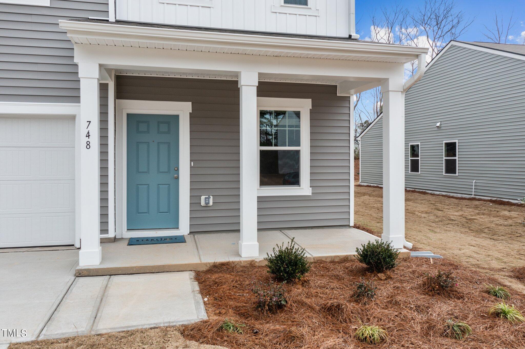 904 Rift Vly Drive Zebulon, NC 27597 - Photo 3 of 43 a view of a house with potted plants