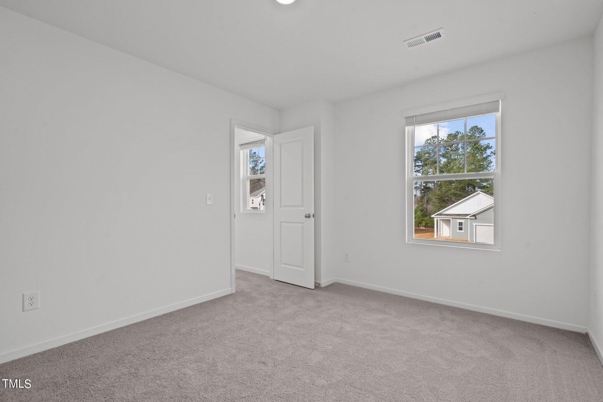 904 Rift Vly Drive Zebulon, NC 27597 - Photo 34 of 43 an empty room with windows