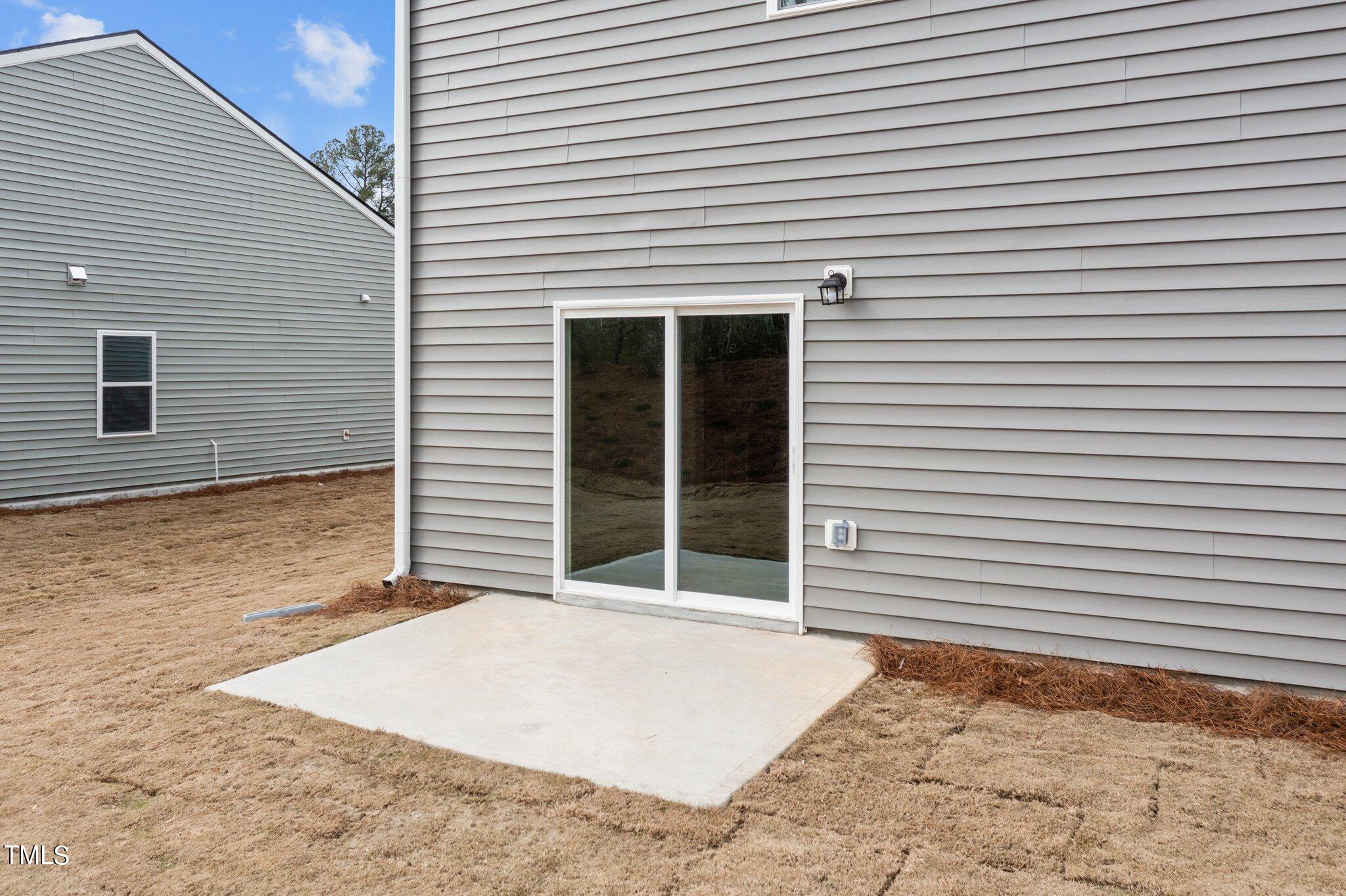 904 Rift Vly Drive Zebulon, NC 27597 - Photo 36 of 43 a view of a backyard with a large tree