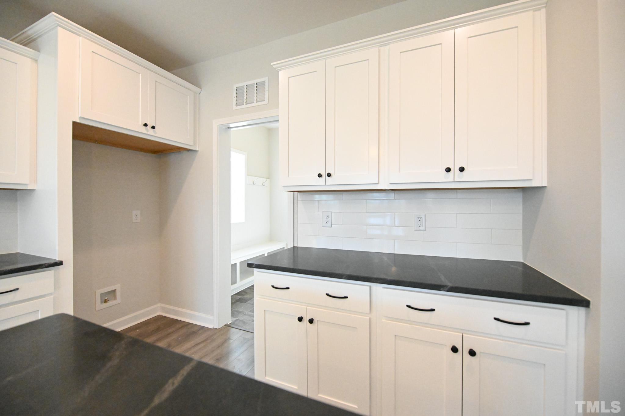 23 Chris Todd Way Angier, NC 27501 - Photo 11 of 28 a view of cabinets and wooden cabinet