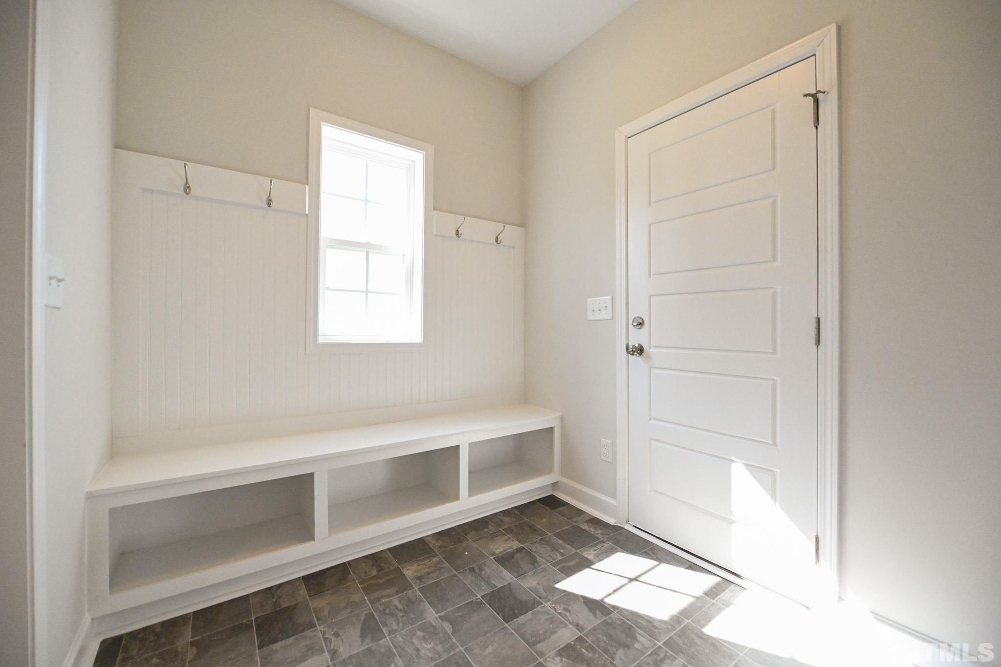 23 Chris Todd Way Angier, NC 27501 - Photo 13 of 28 a view of an empty room with a window