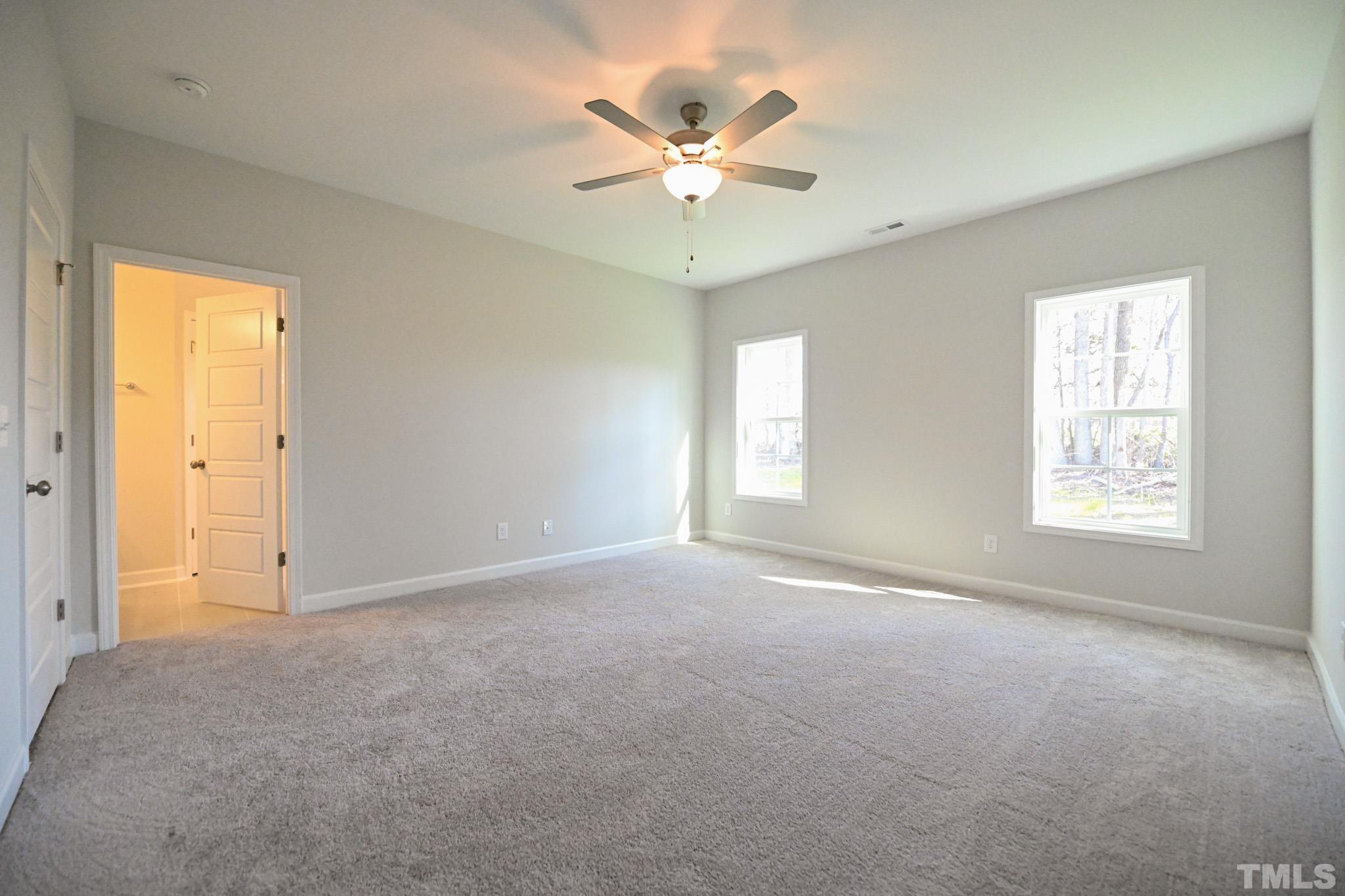 23 Chris Todd Way Angier, NC 27501 - Photo 16 of 28 a view of an empty room with a window