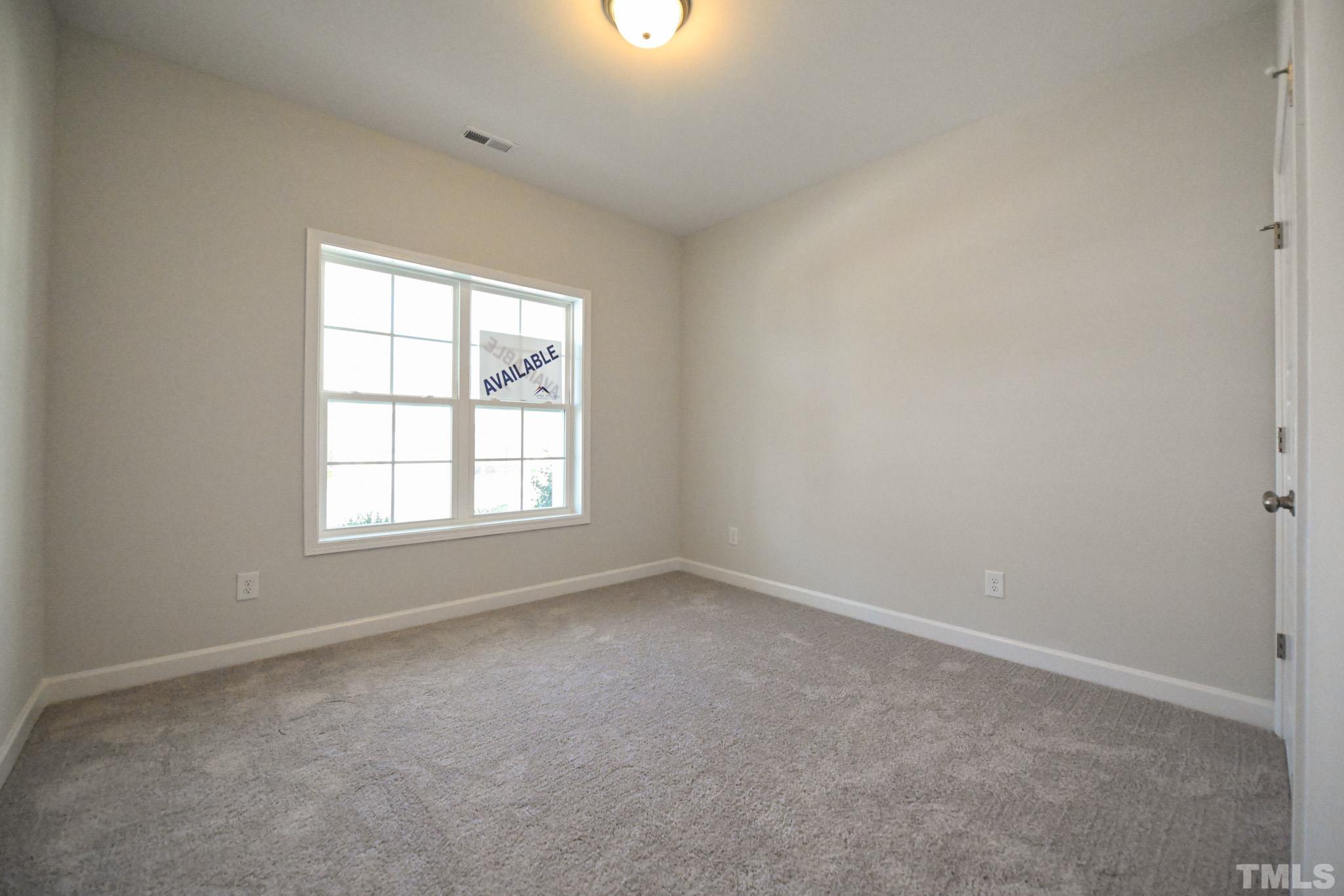 23 Chris Todd Way Angier, NC 27501 - Photo 20 of 28 an empty room with a window