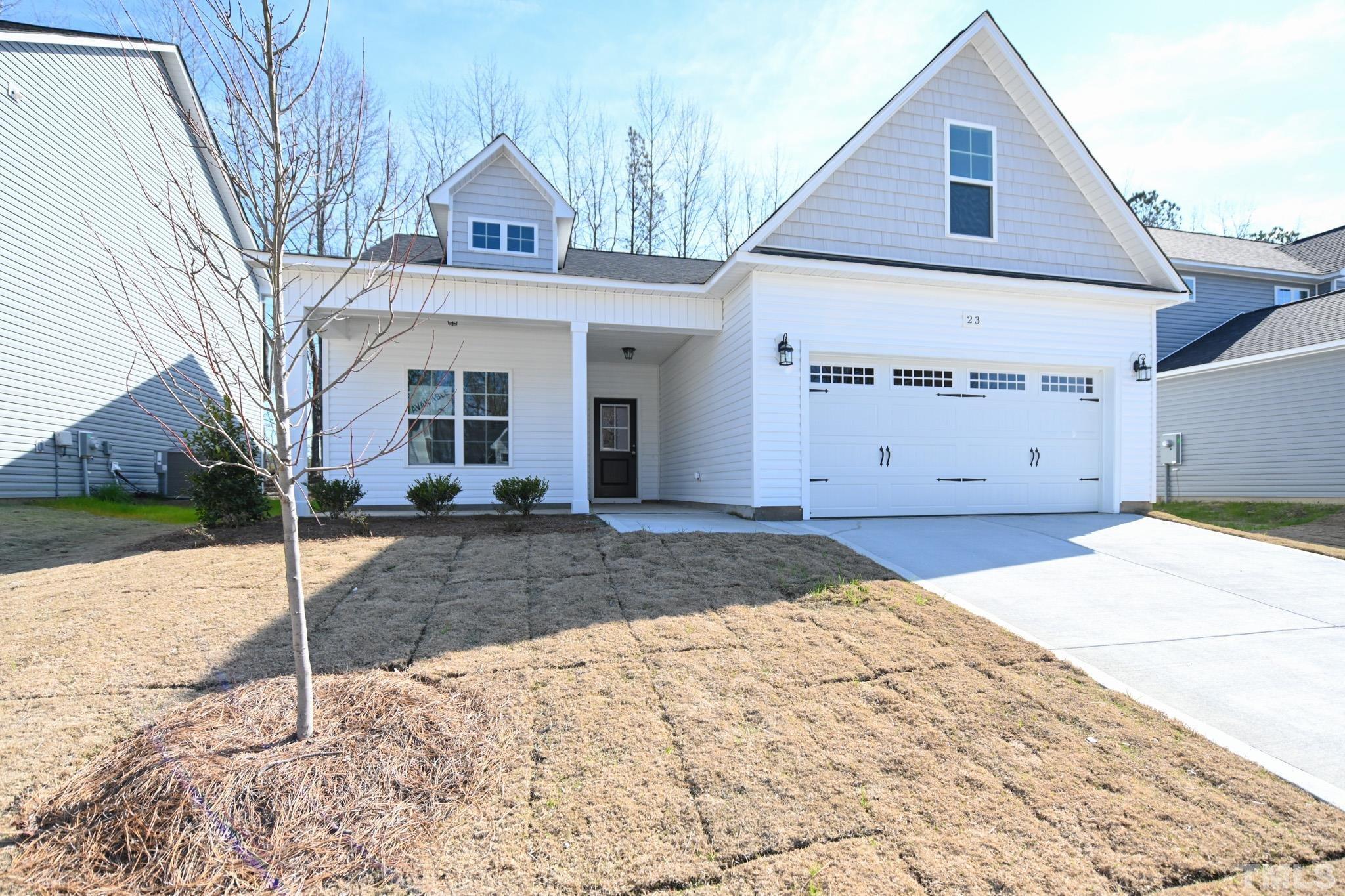 23 Chris Todd Way Angier, NC 27501 - Photo 2 of 28 a view of a white house with a large space