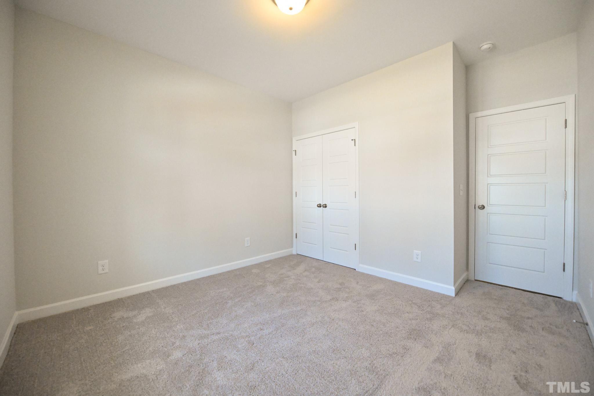 23 Chris Todd Way Angier, NC 27501 - Photo 21 of 28 an empty room with an entryway