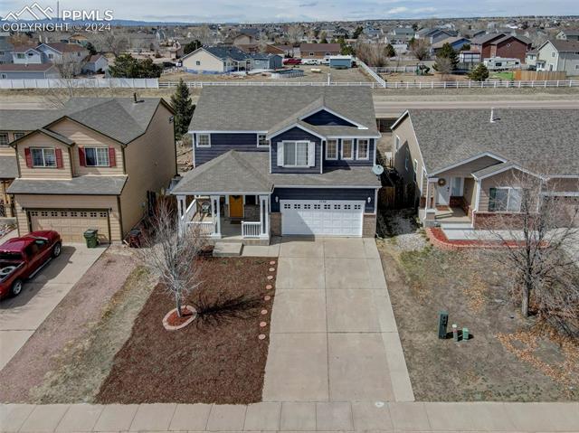 7750 Old Spec Road Peyton, CO 80831 - Photo 3 of 9 View of front facade with a garage