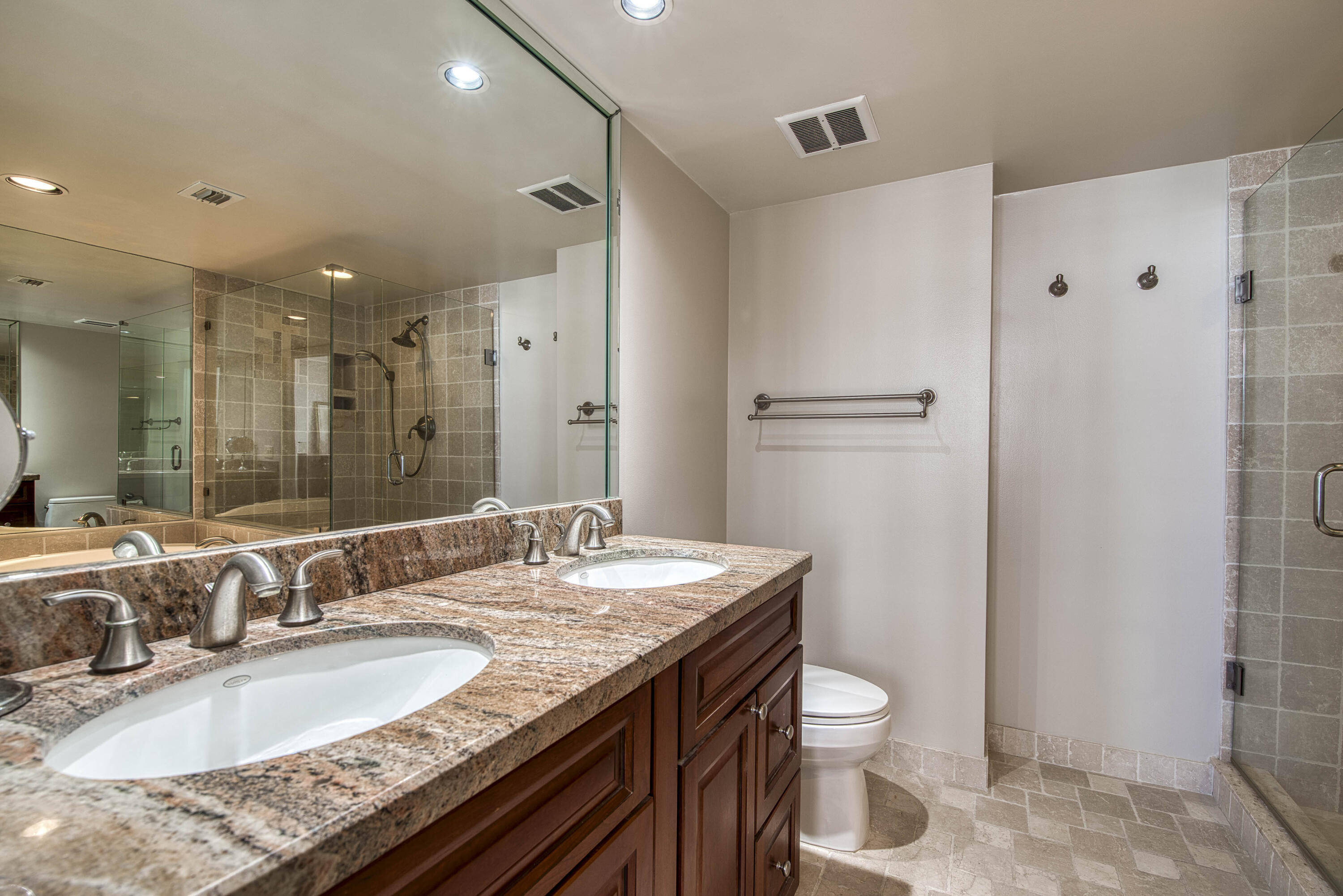 4200 North Ocean Drive, Unit 11405 Singer Island, FL 33404 - Photo 12 of 26 a bathroom with a granite countertop sink toilet and shower