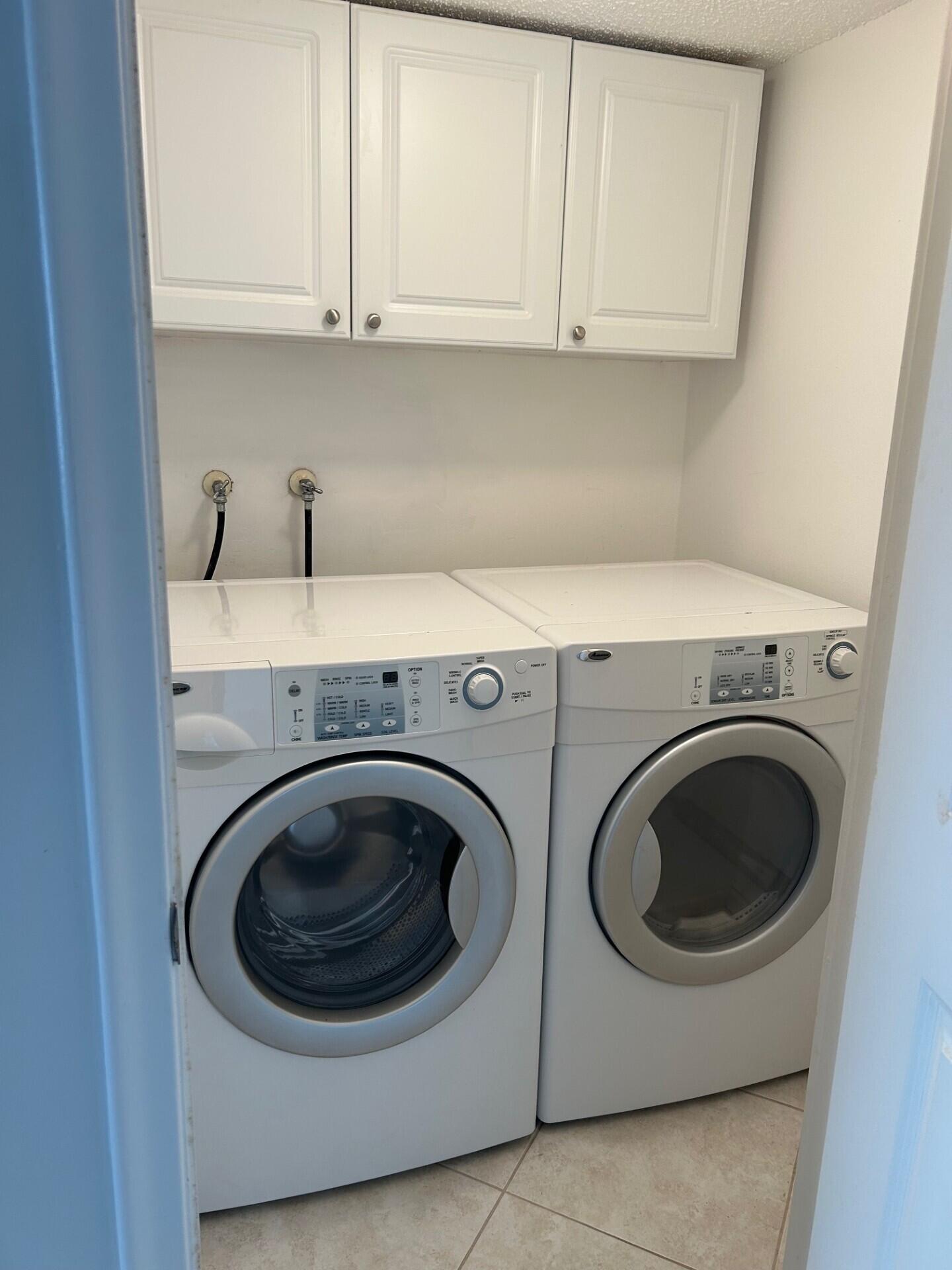 4200 North Ocean Drive, Unit 11405 Singer Island, FL 33404 - Photo 16 of 26 a utility room with dryer and washer