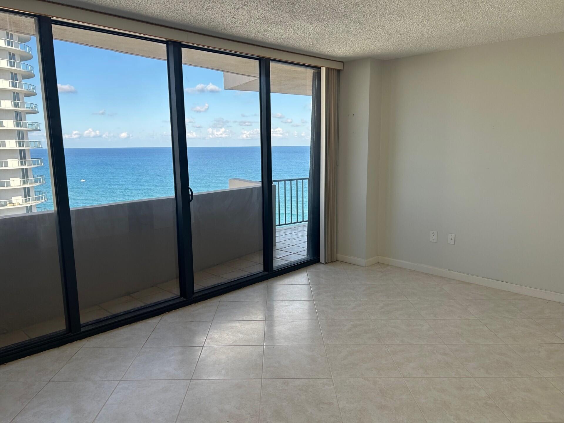 4200 North Ocean Drive, Unit 11405 Singer Island, FL 33404 - Photo 6 of 26 an empty room with windows