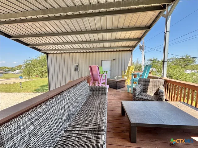 a view of walk in closet with clothes