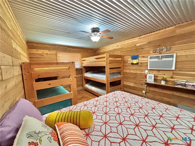 a bathroom with a sink a mirror and bathtub