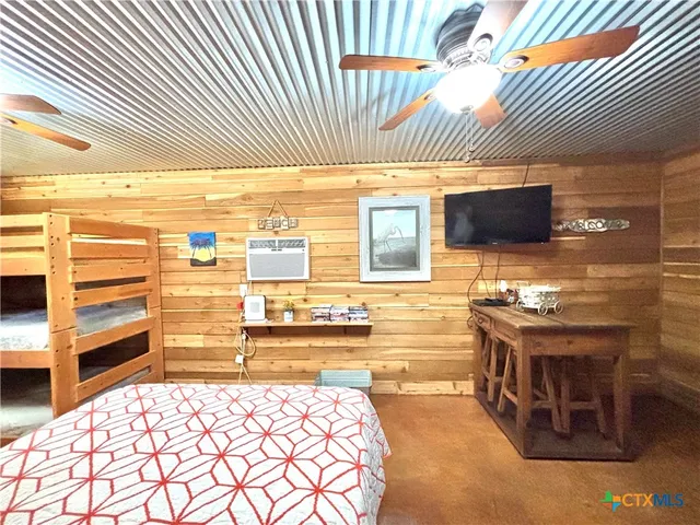 a living room with a flat screen tv on the wall