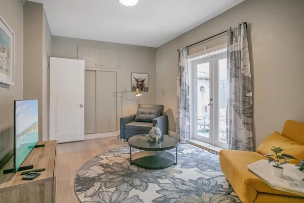 a living room with furniture and a flat screen tv