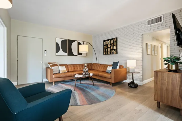 a living room with furniture and a couch