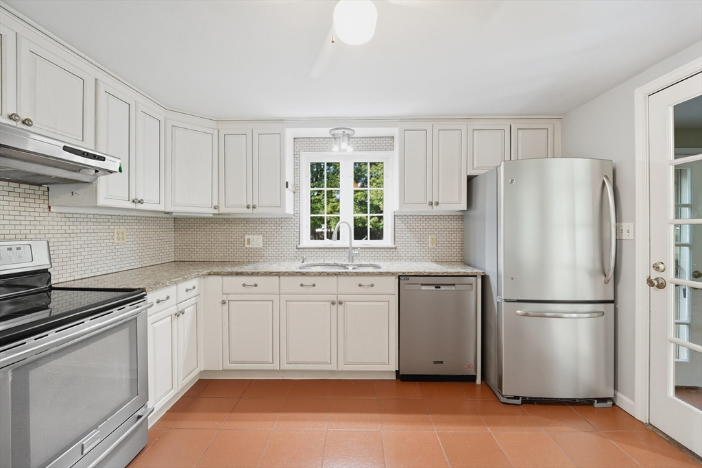 1636 Longmeadow Street Longmeadow, MA 01106 - Photo 11 of 33 a kitchen with a refrigerator stove and microwave