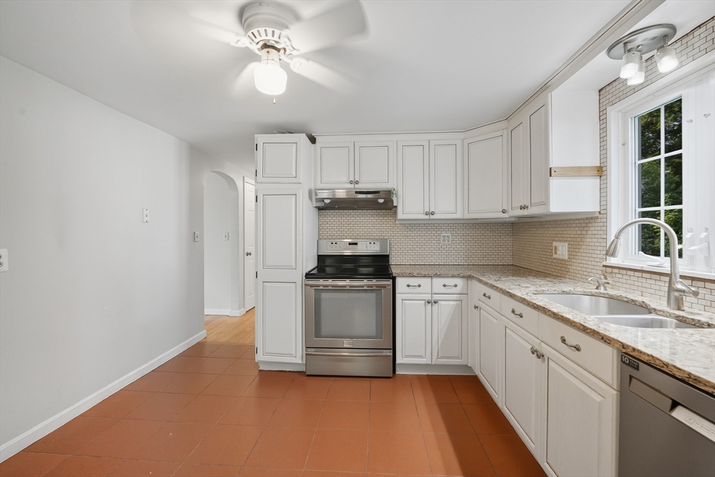 1636 Longmeadow Street Longmeadow, MA 01106 - Photo 13 of 33 a kitchen with cabinets stainless steel appliances and a window